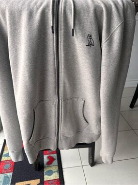 OVO Men's Light Gray Zip-Up Hoodie with Owl Logo